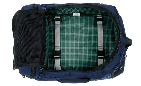 An open Techonaut 45 with a Deep Blue (dark blue) exterior and a Sitka (dark green) interior.